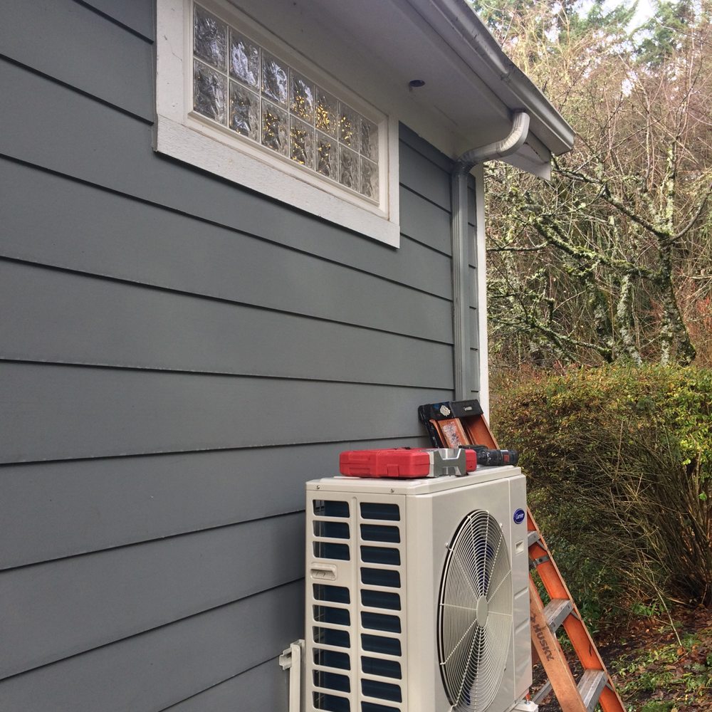 Specialty Heating & Cooling - In progress installation outside of the heat pump. Went up through the roof (hole show in picture) - Heating & Air Conditioning/HVAC Near Me - Portland, Oregon Specialty Heating & Cooling - In progress installation outside of the heat pump. Went up through the roof (hole show in picture) - Heating & Air Conditioning/HVAC Near Me - Portland, Oregon
