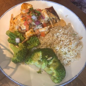 Red Lobster - A plate with cooked rice, steamed broccoli, and a dish topped with melted cheese, salsa, and garnishes. - Seafood Near Me - Eugene, Oregon