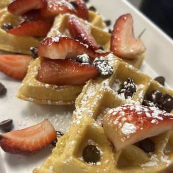 Triple Berry Cafe - Waffle with strawberry, chocolate chips, and powdered sugar - Breakfast & Brunch Near Me - Crystal Lake, Illinois