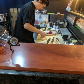 Motto Sushi - The owner/sushi chef hard at work! It's a joy to see someone in their element! - Sushi Bars Near Me - Denton, Texas Motto Sushi - The owner/sushi chef hard at work! It's a joy to see someone in their element! - Sushi Bars Near Me - Denton, Texas