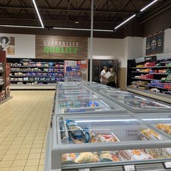 ALDI - Bin of boxes at other end and staff.