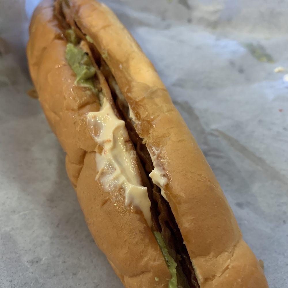 a sandwich with meat, cheese, and lettuce a sandwich with meat, cheese, and lettuce