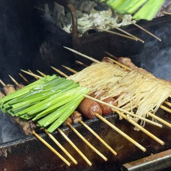 Juewei BBQ - enoki mushroom, onion skewer and some meat skewers under that.. - Chinese Near Me - Flushing, New York