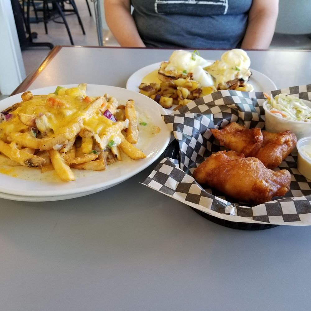 The Cup - Left, is the chowder fries. Middle, Dungeness crab Benedict with home fries, and right, is hand batter cod. - Breakfast & Brunch Near Me - Port Townsend, Washington