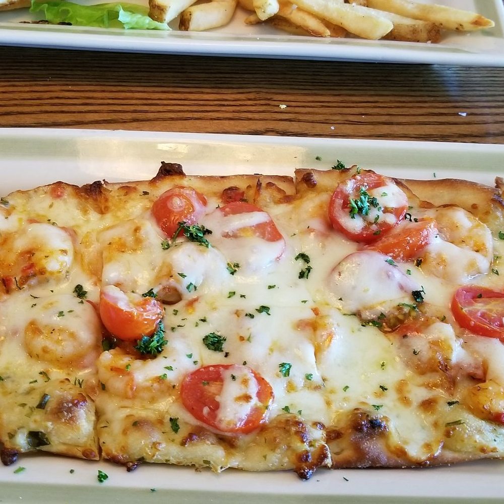 99 Restaurants - Shrimp Flatbread is amazing!  Garlic sauce with fresh shrimp, mozzarella, provolone cheese and cherry tomatoes.  I couldn't even finish it!! - Pubs Near Me - Kingston, New York