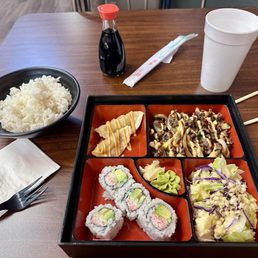 Customizable Bento Box with white rice, bulgogi, pork gyoza, and California roll