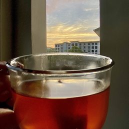 Drinking my morning tea, on my balcony while watching the sunrise Drinking my morning tea, on my balcony while watching the sunrise