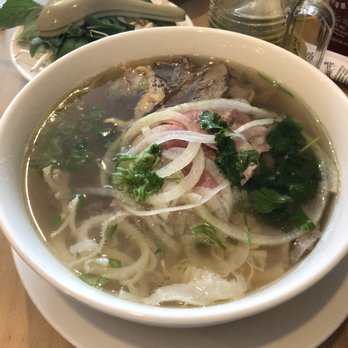 Pho Basil - Dac Biet (Famous Vietnamese beef noodle soup with rare steak, well done flank, tendon and tripe)($9.95) - Vietnamese Near Me - Boston, Massachusetts Pho Basil - Dac Biet (Famous Vietnamese beef noodle soup with rare steak, well done flank, tendon and tripe)($9.95) - Vietnamese Near Me - Boston, Massachusetts