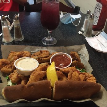 The Press - Shrimp Po Boy with side Fried Pickles - Burgers Near Me - Saint Augustine, Florida The Press - Shrimp Po Boy with side Fried Pickles - Burgers Near Me - Saint Augustine, Florida