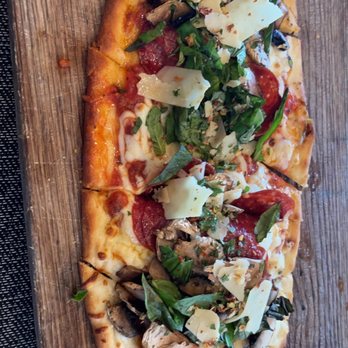 STIRR - Double pepperoni flatbread with mushrooms - Cocktail Bars Near Me - Dallas, Texas