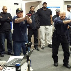 Illinois Concealed Carry Training Academy - Part of the class practicing aiming with our laser and video equipment.
