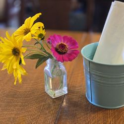 South Store Cafe - Cute flowers on each table.