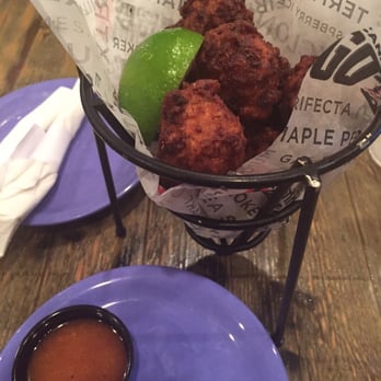 Hurricane Grill & Wings - Conch fritters with coco loco sauce- a little more toasted than wanted but conch meat was awesome! - American Near Me - Lake Worth, Florida