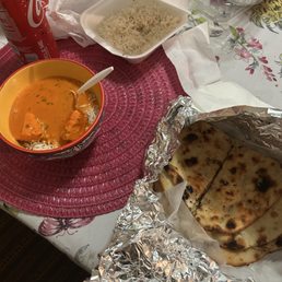 Chicken tikka Masala, butter Naan, and rice. Chicken tikka Masala, butter Naan, and rice.