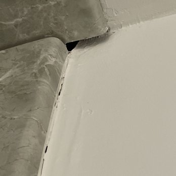 Re-Bath - the corner of a bathtub with a hole in it - Kitchen & Bath Near Me - Irondale, Alabama Re-Bath - the corner of a bathtub with a hole in it - Kitchen & Bath Near Me - Irondale, Alabama