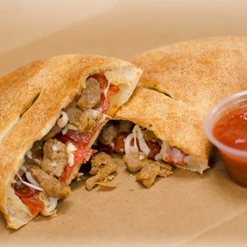 Snappy Tomato Pizza - a sandwich cut in half with a side of ketchup - Pizza Near Me - Walton, Kentucky