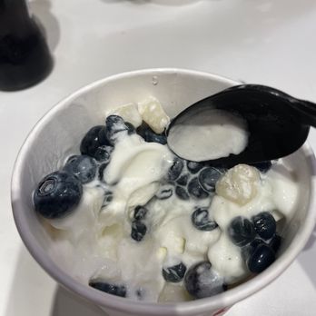Red Mango - a bowl of yogurt and a spoon - Ice Cream & Frozen Yogurt Near Me - New York, New York