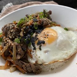 Kalbi - Bulgogi beed with steamed rice and an egg. Very tasty.