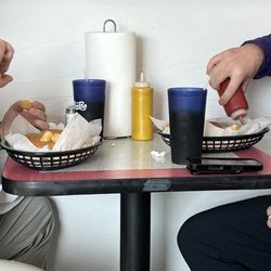 Eddie's Sandwich Shop - Guys indulging in bologna and hamburger sandwiches.