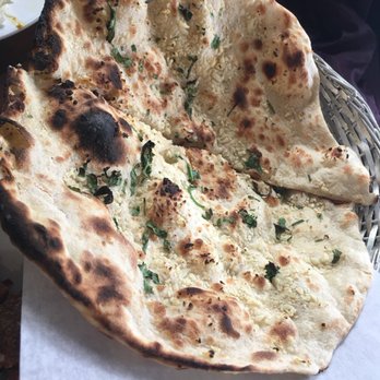 Tandoori Hut - Garlic Naan (no butter).. ABSOLUTELY MELTS IN YOUR MOUTH! - Indian Near Me - Buffalo, New York Tandoori Hut - Garlic Naan (no butter).. ABSOLUTELY MELTS IN YOUR MOUTH! - Indian Near Me - Buffalo, New York