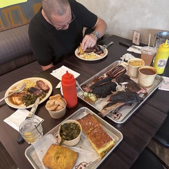 Drinking Pig BBQ - Cornbread, collard greens, Jamaican spicy patties, large mac n cheese, bbq beans, 1 piece large beef rib, brisket, pork belly and ribs. - Barbeque Near Me - Miami, Florida Drinking Pig BBQ - Cornbread, collard greens, Jamaican spicy patties, large mac n cheese, bbq beans, 1 piece large beef rib, brisket, pork belly and ribs. - Barbeque Near Me - Miami, Florida