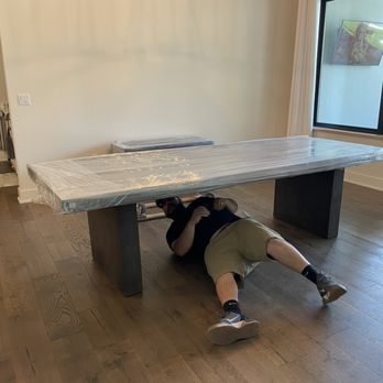 Quick Move ATX Delivery Services - Aaron assembling a 108in charcoal concrete table - Couriers & Delivery Services Near Me - Buda, Texas Quick Move ATX Delivery Services - Aaron assembling a 108in charcoal concrete table - Couriers & Delivery Services Near Me - Buda, Texas