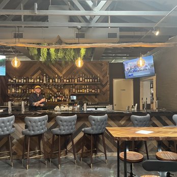 Cryptid - a man behind the bar in a restaurant - Bars Near Me - Wilmington, North Carolina Cryptid - a man behind the bar in a restaurant - Bars Near Me - Wilmington, North Carolina