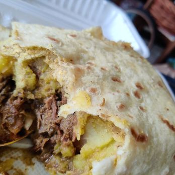 Baby Dhal Roti Shop - Curried goat roti. Awesome. - Caribbean Near Me - Vancouver, British Columbia Baby Dhal Roti Shop - Curried goat roti. Awesome. - Caribbean Near Me - Vancouver, British Columbia