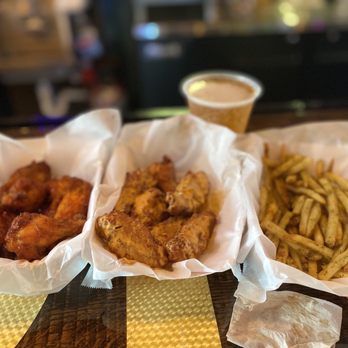 Anchor Draft House - three baskets of food on a table - Chicken Wings Near Me - Indian Beach, North Carolina Anchor Draft House - three baskets of food on a table - Chicken Wings Near Me - Indian Beach, North Carolina