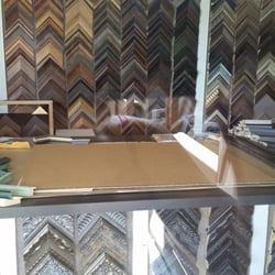 Personal Touch Custom Picture Framing - Outside looking in at their counter and some frame samples. ( oops I forgot it's closed on Sunday ) "I'll be back"after the holiday.