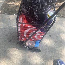 Bag of groceries on top and two packs of chicken on the the bottom all purchased in another store