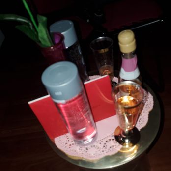 Serenity Rose Massage & Wellness - Table service up with anniversary card I brought for my husband and water, and champagne. - Massage Therapy Near Me - Hypoluxo, Florida