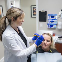 Collins Dental - Dr. Hunt prepares a patient for treatment for TMJ/TMD