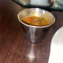 Half side of Creole Gravy The half is $2 or $2.50. The full side comes in their regular white side dish cups for $4.