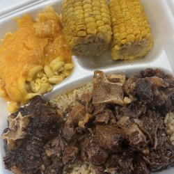 Antie Ruth’s Kitchen - Oxtail , seafood rice, Mac N Cheese and corn