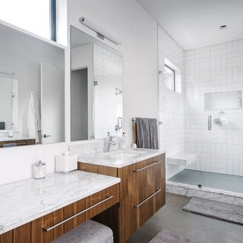 Just The Wright Interiors - Spa-inspired luxury. Double walnut vanities and marble counters paired with a seamless glass rain shower for ultimate tranquility. - Interior Design Near Me - Canton, Ohio Just The Wright Interiors - Spa-inspired luxury. Double walnut vanities and marble counters paired with a seamless glass rain shower for ultimate tranquility. - Interior Design Near Me - Canton, Ohio