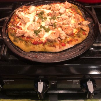 Meez Meals - a pizza on a pan on a stove - Food Delivery Services Near Me Meez Meals - a pizza on a pan on a stove - Food Delivery Services Near Me
