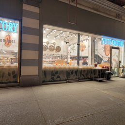the outside of a storefront at night the outside of a storefront at night