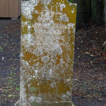 Huguenot Cemetery - A weathered headstone, practically illegible. - Funeral Services & Cemeteries Near Me - St Augustine, Florida