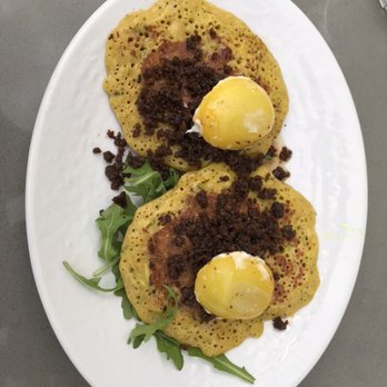 SOFRA Bakery & Cafe - Chickpea pancake. The yellow things on top are tomatoes. - Middle Eastern Near Me - Cambridge, Massachusetts