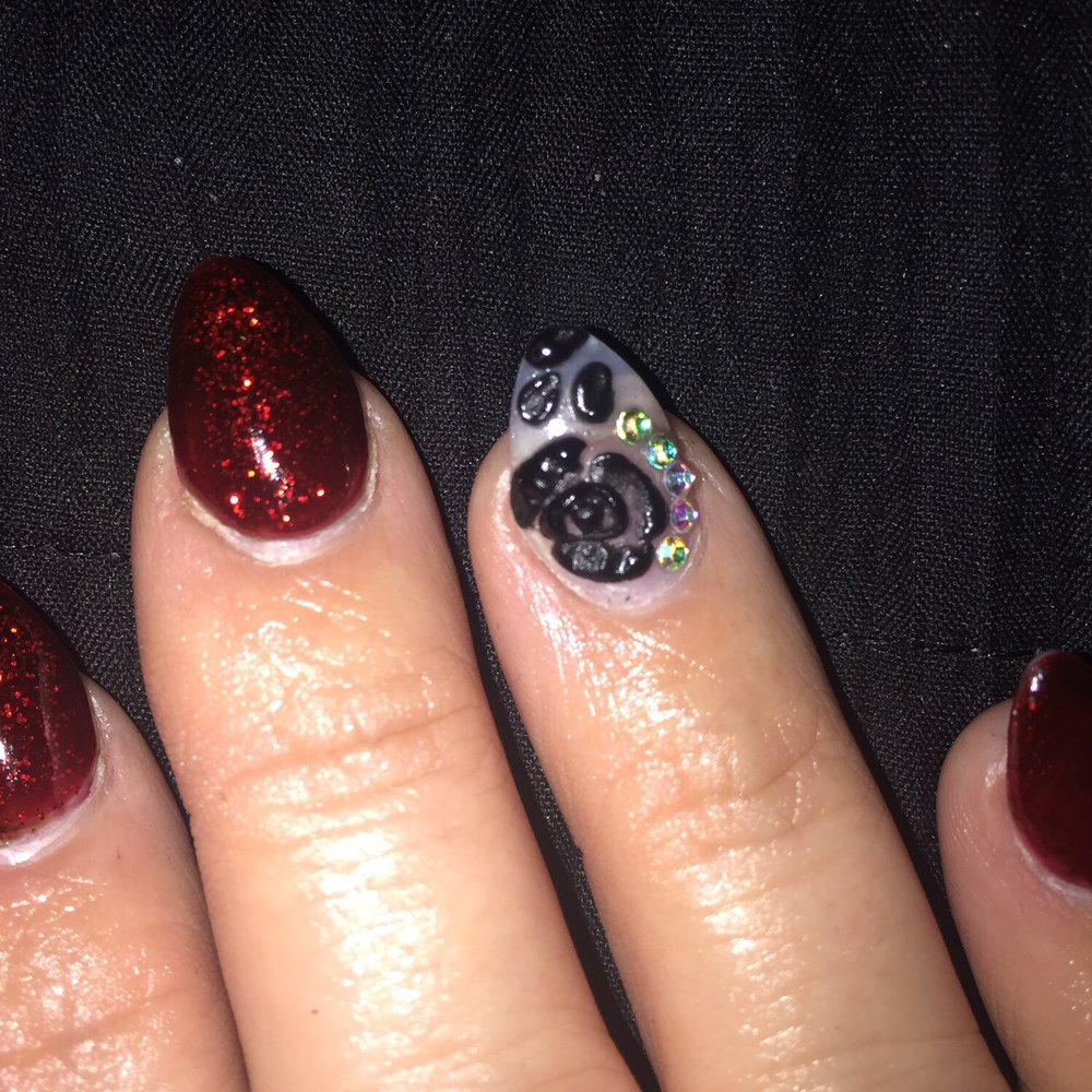 Million Nails & Bar - Tried to get a closer view of the Rose, but it looks much better in person. Lol  P.s. This 1 full week after getting them done. - Nail Salons Near Me - Grand Prairie, Texas