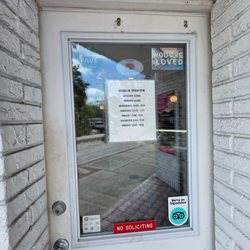 Joey Biscotti - Joey Biscotti Gourmet Bakery business hours on the entrance door.