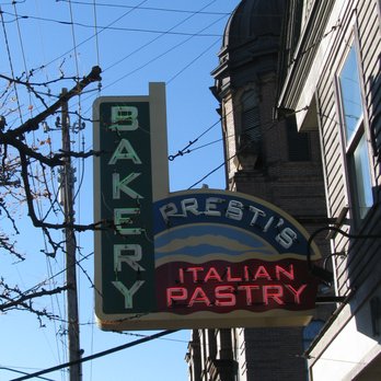 Presti's Bakery - This is their sign, with the church belfry and Little Italy banner seen beyond. - Bakeries Near Me - Cleveland, Ohio