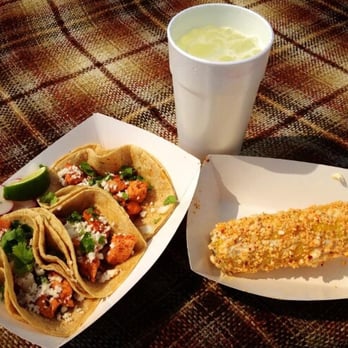 Holy Molé - two tacos and a drink on a table - Food Trucks Near Me - Louisville, Kentucky Holy Molé - two tacos and a drink on a table - Food Trucks Near Me - Louisville, Kentucky
