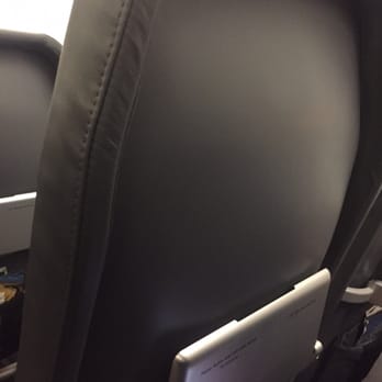 Frontier Airlines - Plastic seat with no cushion on frontier - Airlines Near Me - Denver, Colorado
