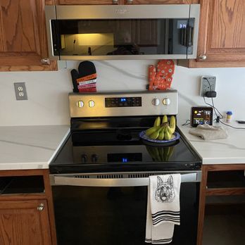 Trindco - a kitchen with wooden cabinets and stainless steel appliances - Interior Design Near Me - Suffolk, Virginia Trindco - a kitchen with wooden cabinets and stainless steel appliances - Interior Design Near Me - Suffolk, Virginia