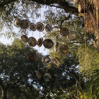 Lightnin' Salvage - Hubcap sculpture in the parking lot - Bars Near Me - Gainesville, Florida