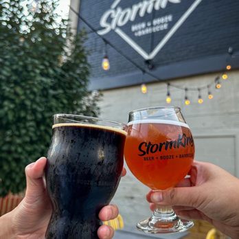 StormKing Brewpub - two people holding glasses of beer - Barbeque Near Me - Minneapolis, Minnesota StormKing Brewpub - two people holding glasses of beer - Barbeque Near Me - Minneapolis, Minnesota