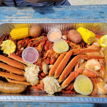 Out Da Ditch Crawfish - Cajun Feast- 3 lbs crawfish, 1 lbs huge shrimp, 2 crab clusters, 2 potatoes, 2 corn, 2 sausages, pluse butter and remoulade sauce. - Seafood Near Me