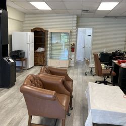 JR Threading Spa - Seating area, refrigerator, retail products cabinet, & front view of spa